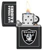 NFL Las Vegas Raiders Windproof Lighter with its lid open and lit.