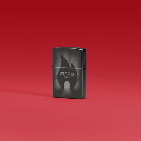 Lifestyle image of Zippo Radiant Zippo Design High Polish Black Windproof Lighter standing in a red scene.