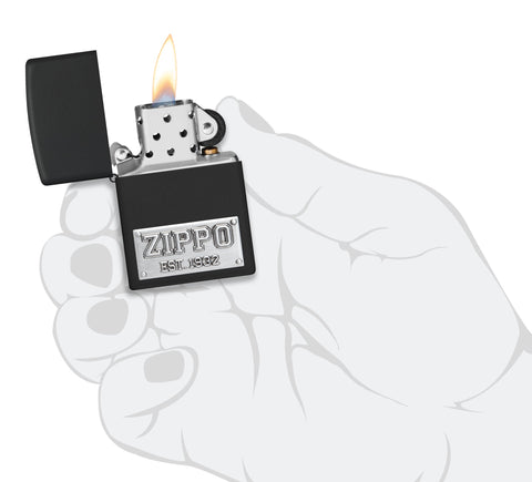 Zippo Wolf Emblem Design Brushed Chrome Windproof Lighter lit in hand.