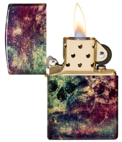 Zippo Galaxy Skull Design 540 Tumbled Brass Windproof Lighter with its lid open and lit.