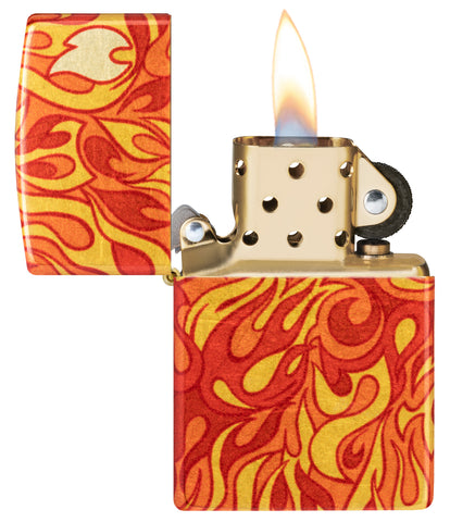 Zippo Fire Design 540 Tumbled Brass Windproof Lighter with its lid open and lit.