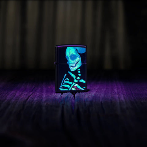 Lifestyle image of Zippo Glowing Skull Design Black Matte Windproof Lighter glowing in a black light.