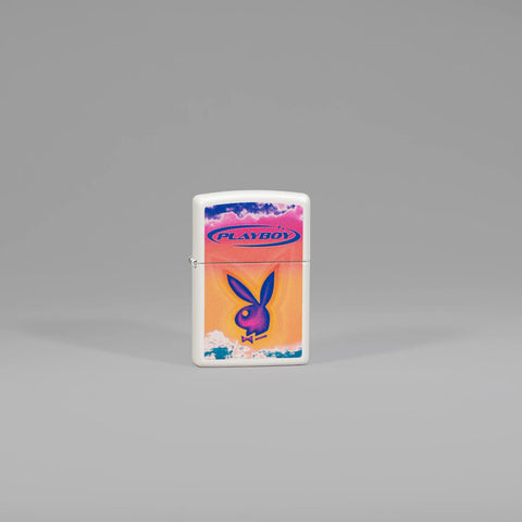 Lifestyle image of Zippo Playboy White Matte Windproof Lighter standing in a grey scene.