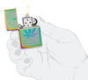 Zippo Cannabis Design Multi-Color Windproof Lighter lit in hand.
