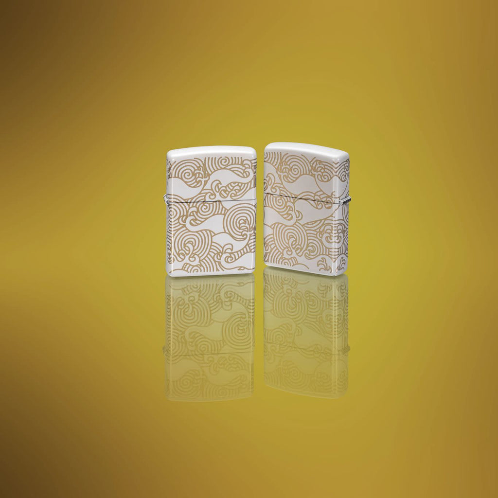 Lifestyle image of two Zippo Waves Design White Matte Pocket Lighters.
