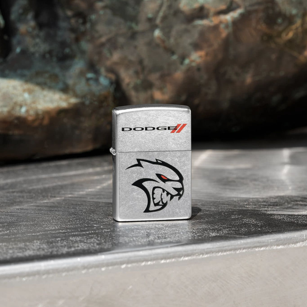 Lifestyle image of Zippo Dodge Street Chrome Windproof Lighter standing on a metal shelf.