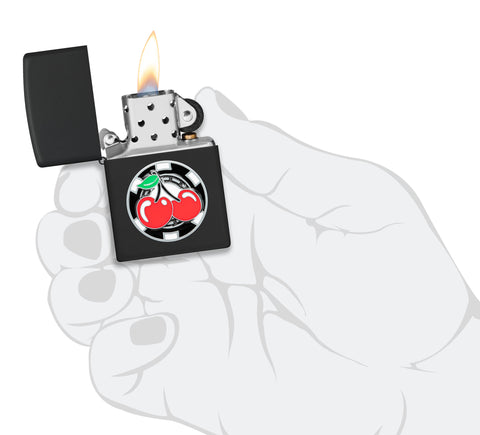 Zippo Poker Chip with Cherries Emblem Black Matte Windproof Lighter lit in hand.