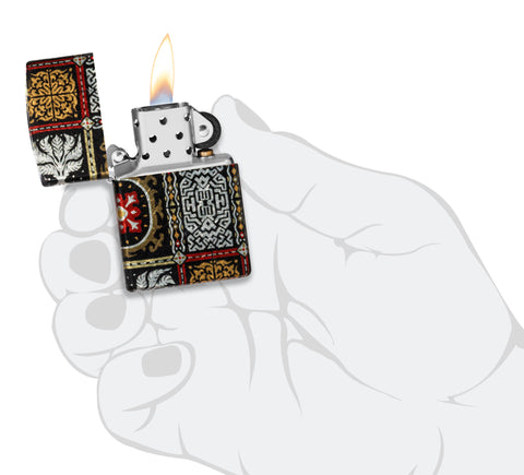 Zippo Tapestry Pattern Design 540 Tumbled Chrome Windproof Lighter lit in hand.