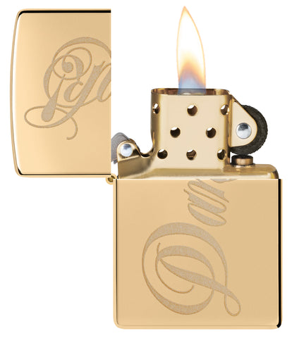 Zippo Dank Design High Polish Brass Windproof Lighter with its lid open and lit.