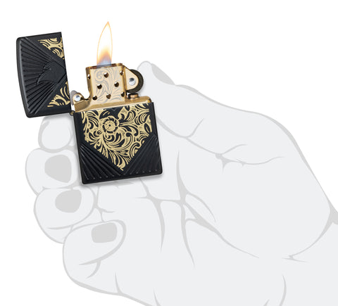 Zippo 2024 Collectible of the Year Windproof Lighter lit in hand.