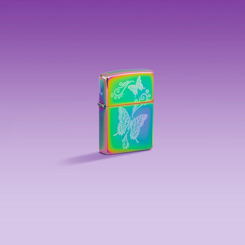 Lifestyle image of Zippo Butterfly Design Multi-Color Windproof Lighter on a purple ombre background.