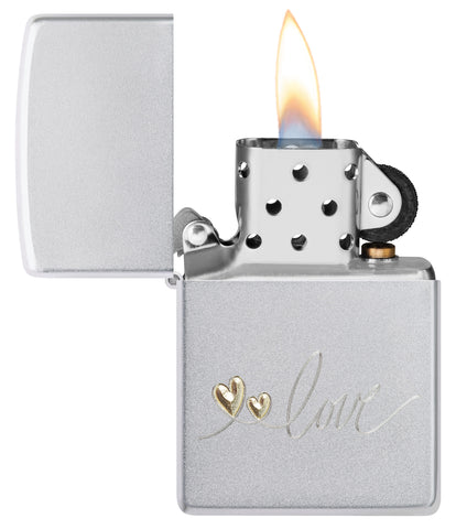Zippo Love Design Satin Chrome Windproof Lighter with its lid open and lit.