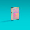 Lifestyle image of Zippo Cannabis Design Multi-Color Windproof Lighter on a teal ombre background.