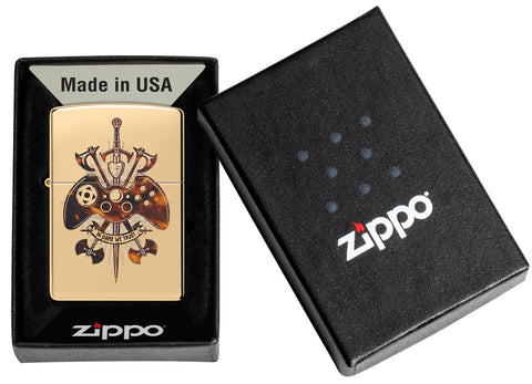 Zippo Gamer Creed Design High Polish Brass Windproof Lighter in its packaging.