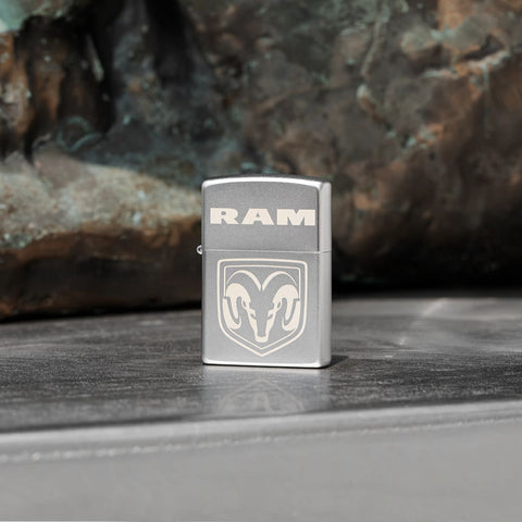 Lifestyle image of Zippo RAM Satin Chrome Windproof Lighter standing on metal.