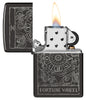 Zippo Wheel of Fortune Design High Polish Black Windproof Lighter with its lid open and lit.