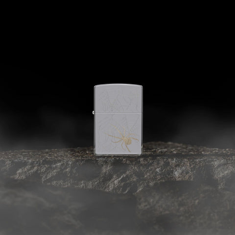 Lifestyle image of Zippo Spider Web Design High Polish Chrome Windproof Lighter.