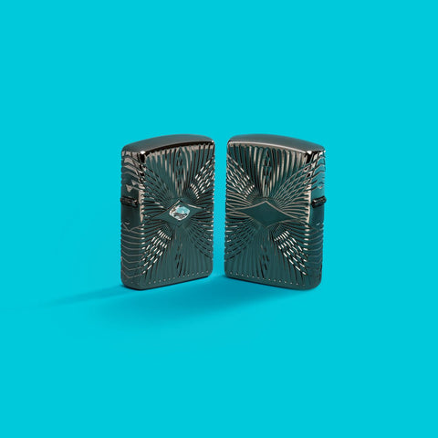 Lifestyle image of two Zippo Pattern Armor Black Ice Windproof Lighters on an aqua blue background.