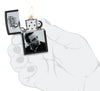 Zippo Johnny Cash Black Matte Windproof Lighter lit in hand.