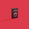 Lifestyle image of Zippo Johnny Cash Black Crackle Windproof Lighter on a red background.