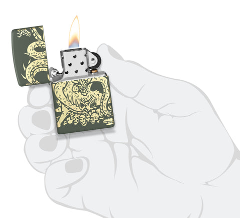 Zippo Dragon Design Green Matte Windproof Lighter lit in hand.
