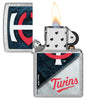 MLB® Minnesota Twins™ Street Chrome™ Windproof Lighter with its lid open and lit.