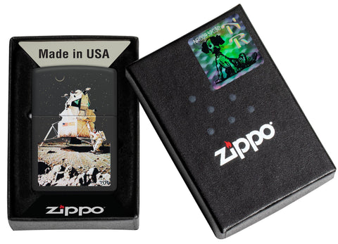 Zippo Norman Rockwell Man on the Moon Black Matte Windproof Lighter in its packaging.
