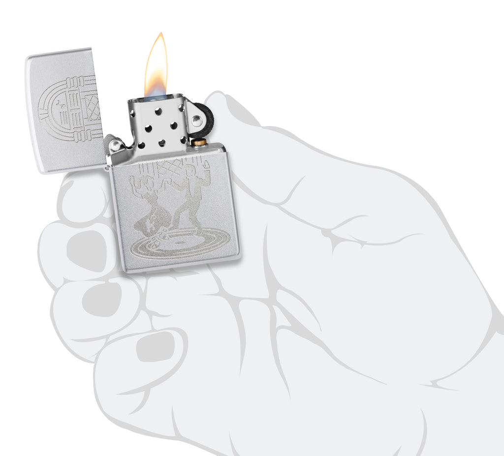 Zippo Vintage Dance Design Satin Chrome Windproof Lighter lit in hand.