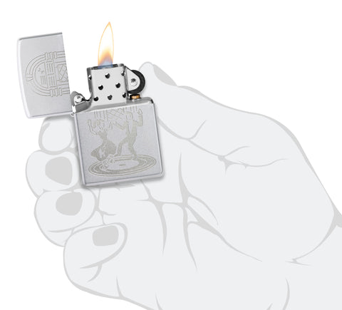 Zippo Vintage Dance Design Satin Chrome Windproof Lighter lit in hand.