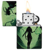 Zippo Glowing Dragon Design 540 Color Glow in the Dark Windproof Lighter with its lid open and lit.