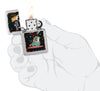 Zippo Cool Chick Design Satin Chrome Windproof Lighter lit in hand.