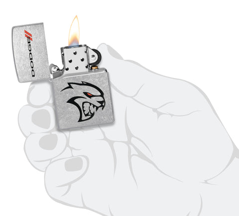 Zippo Dodge Street Chrome Windproof Lighter lit in hand.