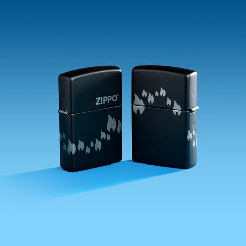 Lifestyle image of two Zippo Design Black Matte with Chrome Windproof Lighters on a blue ombre background.