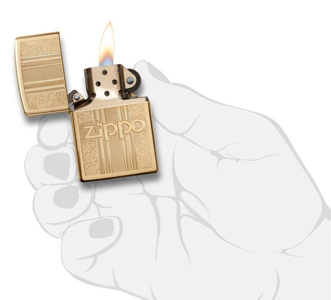 Front view of the Zippo and Pattern Design in hand, open and lit