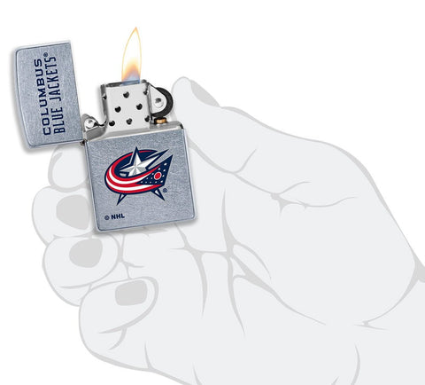 NHL Columbus Blue Jackets Street Chrome™ Windproof Lighter lit in hand