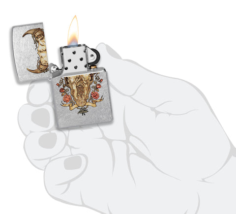 Zippo Rick Rietveld Floral Bull Skull Street Chrome Windproof Lighter lit in hand.