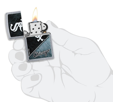 MLB™ Chicago White Sox™ Street Chrome™ Windproof Lighter lit in hand.