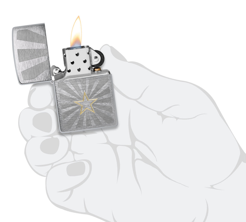 Zippo Star Design Brushed Chrome Windproof Lighter lit in hand.