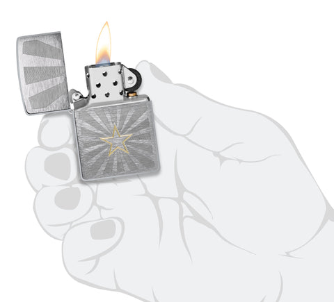 Zippo Star Design Brushed Chrome Windproof Lighter lit in hand.
