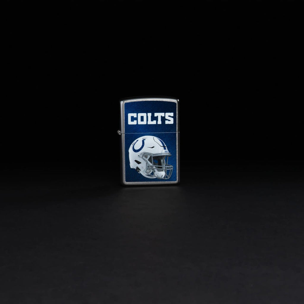 Lifestyle image of NFL Indianapolis Colts Helmet Street Chrome Windproof Lighter standing in a black background.