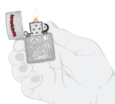 Zippo Iron Maiden Eddie Street Chrome Windproof Lighter lit in hand.