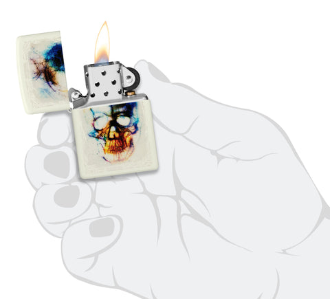Zippo Zippo Skull Print Design Glow in the Dark Matte Windproof Lighter lit in hand.