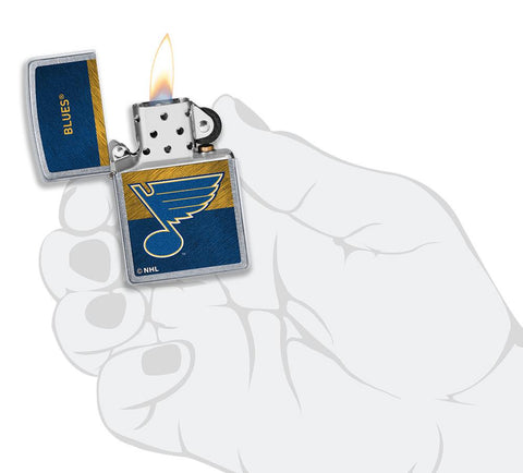 NHL® St Louis Blues Street Chrome™ Windproof Lighter lit in hand