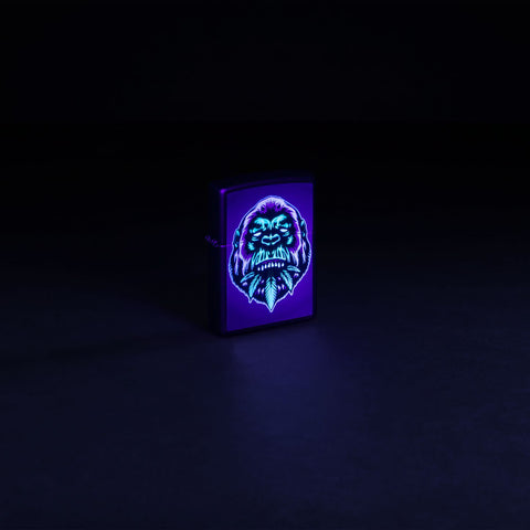 Glamour shot of Zippo Black Light Cannabis Gorilla Design Black Matte Windproof Lighter glowing with a black light.