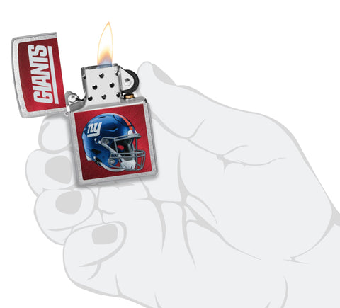 NFL New York Giants Helmet Street Chrome Windproof Lighter lit in hand.