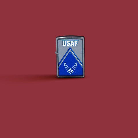 Glamour shot of Zippo U.S. Air Force Design Street Chrome Windproof Lighter standing in a red scene.
