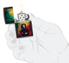 Zippo Black Light Bob Marley Design Black Matte Windproof Lighter lit in hand.
