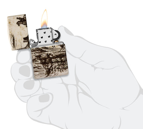 Zippo Wild West Scene Design 540 Color Windproof Lighter lit in hand.