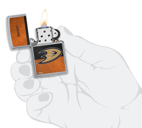 NHL® Anaheim Ducks Street Chrome™ Windproof Lighter lit in hand