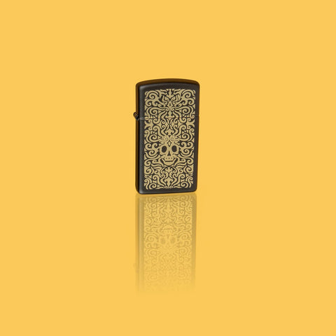 Glamour shot of Zippo Skull Filigree Design Slim Black Matte Windproof Lighter standing in a yellow scene.